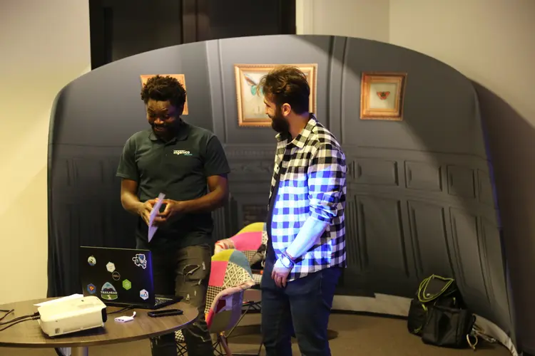 Two developers discussing at BeJS meetup